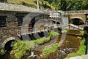 Water Mill Moved By The Force Of A Beautiful Waterfall In Taramundi, Asturias, Spain. Architecture, History, Travel.