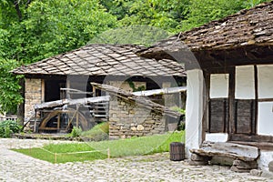 Water mill, an old house and wooden bench in Etara, Bulgaria