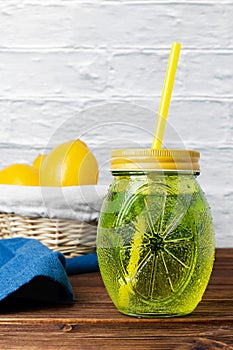 Water with mint in a yellow glass