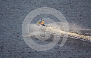 Water motorcycle is rapidly riding on the water surface