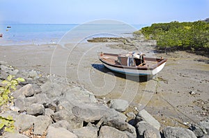 Water moved during low tide leaving boats behind