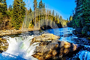 Water of the Murtle River tumbles over the edge of Whirlpool falls in the Cariboo Mountains of Wells Gray Provincial Park