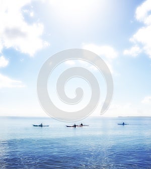 Water, ocean and group rowing kayak on holiday, vacation or travel in summer outdoor. Sea, people and canoeing together