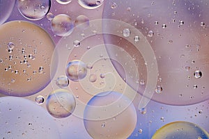 Water oil bubble macro abstract background flow liquid blue white pink