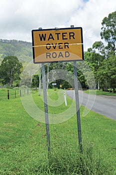 Water over road sign