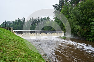 Water overflow from the pond or water reservoir in southern bohemia region of Czech republic.