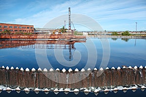 Water overflowing from circular storage tank