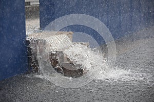 Water overflowing in stadium down wooden stairs