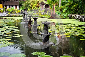 Water Palace of Tirta Gangga, Karangasem, Indonesia. Popular beautiful water palace with fountains and traditional hindu demons