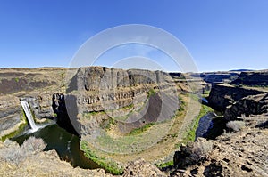 Water from Palouse Falls flows to a canyon