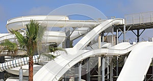 Water park, summer water white slides and attractions in resort