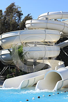 Water park, summer water white slides and attractions in resort