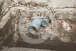 Water pipe in dirty sewer