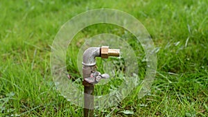Water pipe for hose in grass