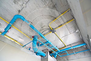 The water pipe system, wastewater pipes and electrical wiring are neatly installed under the ceiling