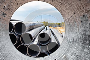 Water pipes for drinking water supply at a construction site. Underground pipeline works. Modern water supply systems for a
