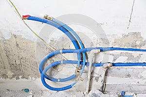 Water pipes made of polypropylene PEX in the wall, plumbing in the house. Installation of sewer pipes in a bathroom of an apartmen