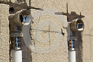 Water pipes made of polypropylene in the wall, plumbing in the house. Installation of sewer pipes in a bathroom of an apartment in