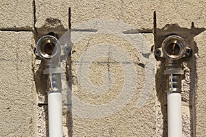 Water pipes made of polypropylene in the wall, plumbing in the house. Installation of sewer pipes in a bathroom of an apartment in