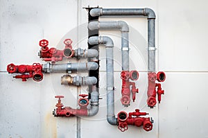 Water pipes with red valves