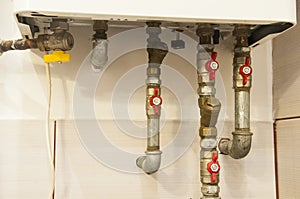 Water pipes and valves connected to heating gas furnace