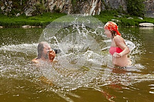 Water play by man and young woman