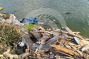 Water pollution - human trash and garbage floating on the surface of the river - Global damage environmental dumping concept