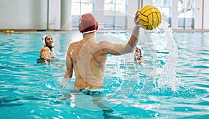 Water polo, ball and people in swimming pool training, exercise and fitness game or sports event. Professional swimmer