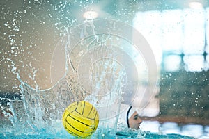 Water polo, ball and splash with athlete in swimming pool training, exercise and fitness game or sports event