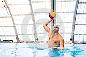 Water polo player in a swimming pool.