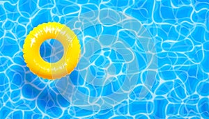 Water pool summer background with yellow pool float ring. Summer blue aqua textured background photo