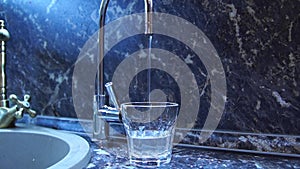 Water is poured in a glass