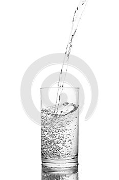 Water poured in  glass transparent white background