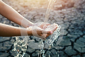 Water pouring on hand in morning ligth background