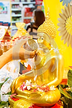 Water pouring to Buddha statue in Songkran festival of Thailand