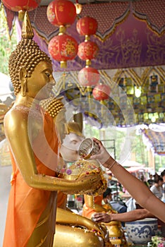 Water pouring to Buddha statue in Songkran festival tradition thailand