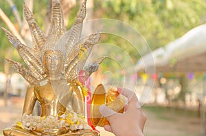 Water pouring to Buddha statue in Songkran festival tradition of thailand