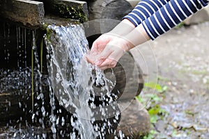 Water pouring in woman hand