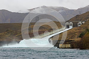 Water pours down a giant slipway at the Benmore Hydro Station, New Zealand