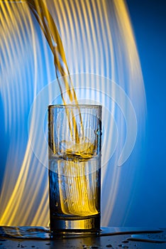 Water pours into the glass