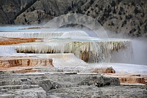 Water pours over a deposited limestone terrace at Mammoth