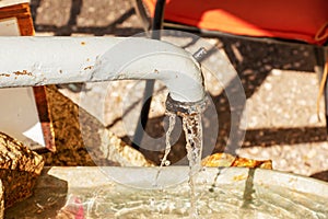 Water pours from a water column in the city of Nitra in Slovakia. Spring clean water