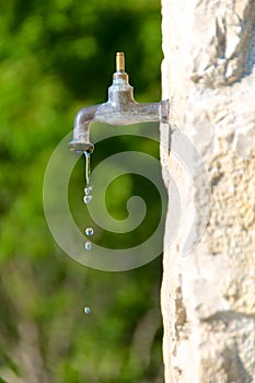 Water preservation, old faucet photo