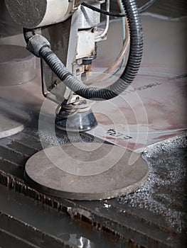 Water pressure cutting through stainless steel