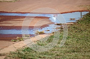 WATER PUDDLE IN A TARRED ROAD