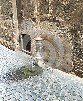 Water Pump on the Paved Streets of Rome Italy