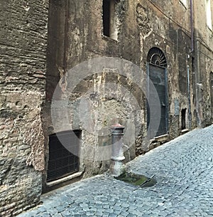 Water Pump on the Paved Streets of Rome Italy