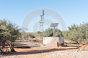 Water-pumping windmill and solar panels for a waterpump photo
