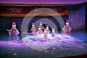 Water puppet show in Vietnam under purple lights