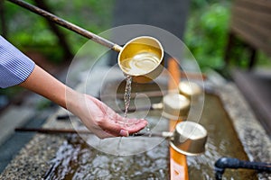 Water purification at entrance of the Japanese temple